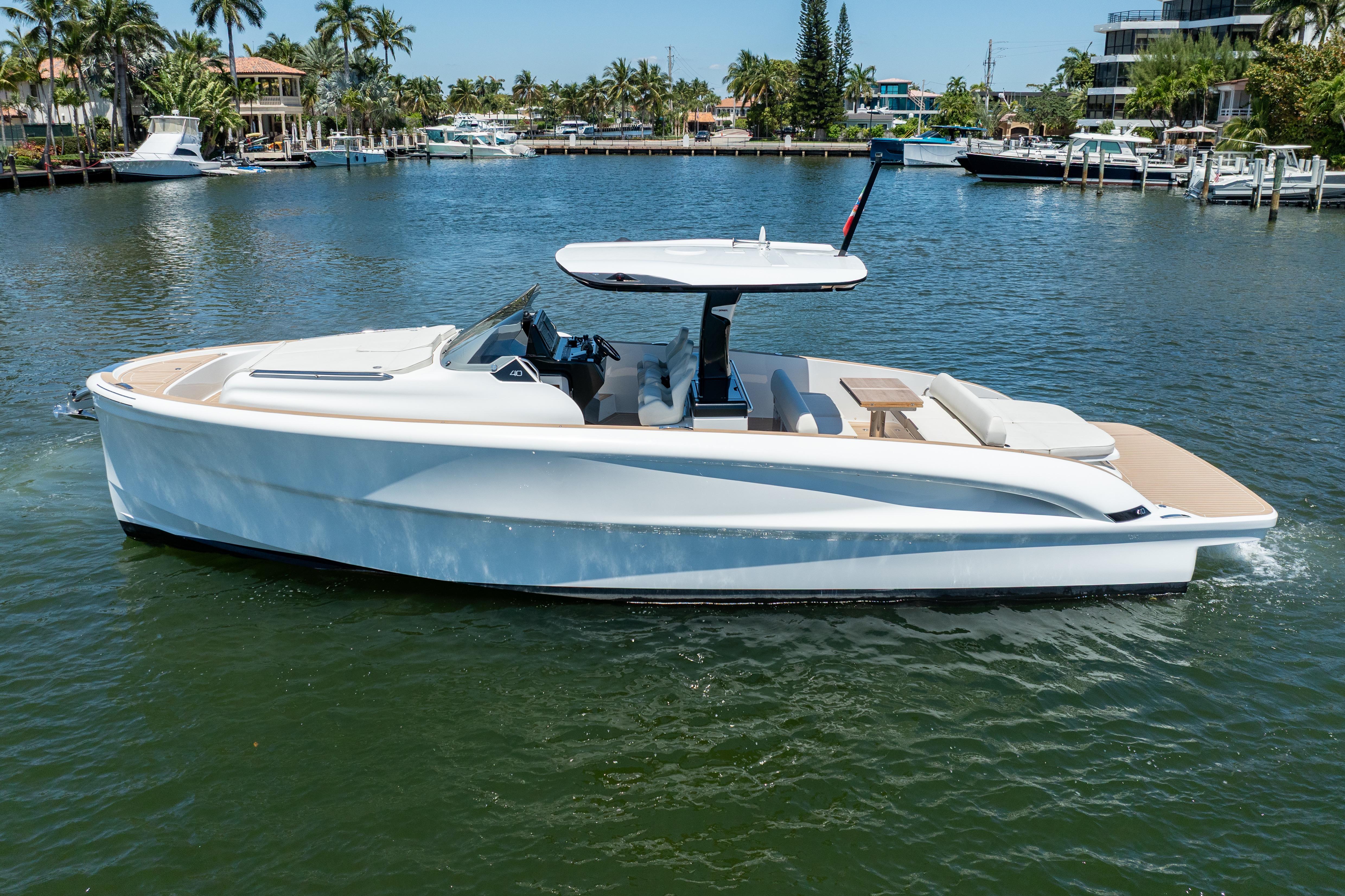 2027 Solaris Power 40 Open yacht cruising on a sunny day in a marina.