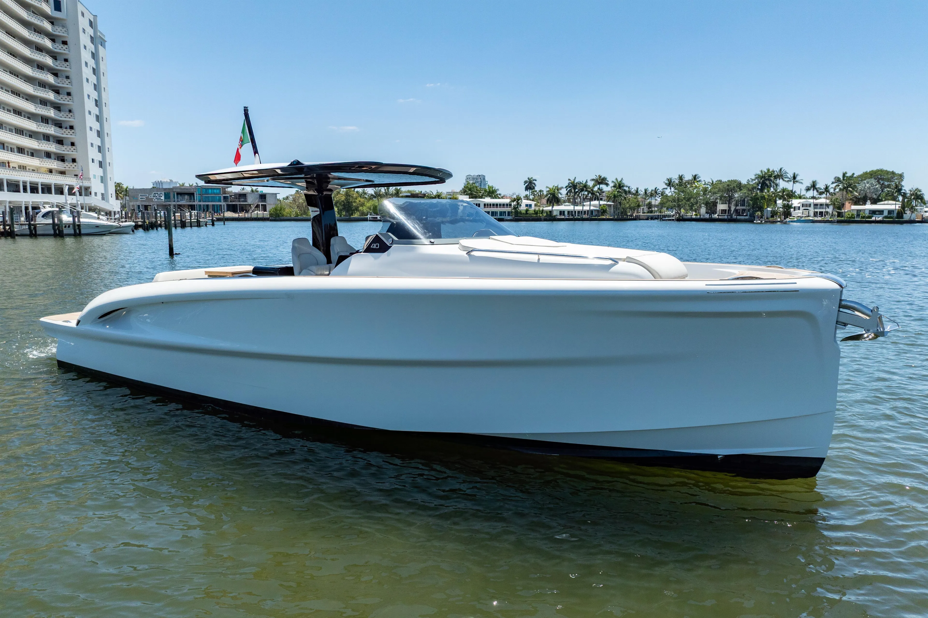 2027 Solaris Power 40 Open yacht on calm water, modern design, sunny day.