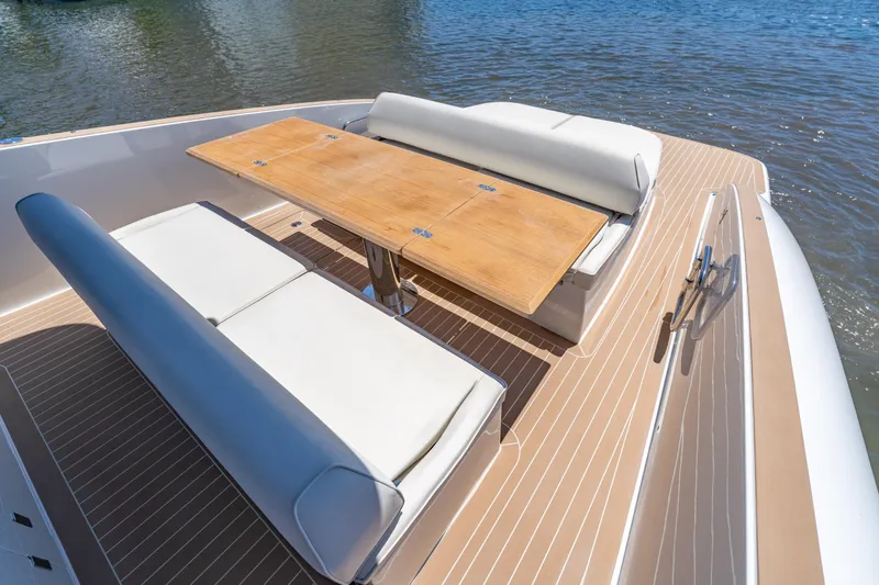  Yacht Photos Pics Luxurious seating area on 2027 Solaris Power 40 Open yacht with wooden table.