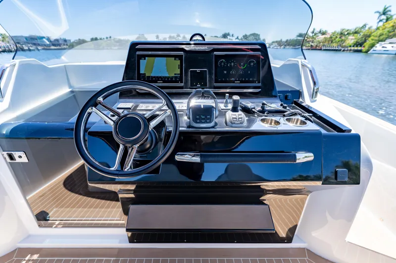  Yacht Photos Pics Helm of 2027 Solaris Power 40 Open yacht with modern navigation controls.