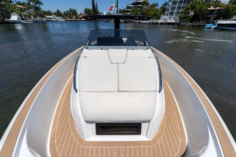  Yacht Photos Pics 2027 Solaris Power 40 Open yacht on a serene waterway, showcasing sleek design and luxury.