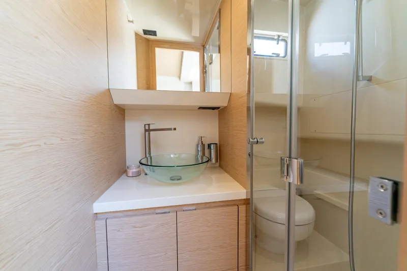  Yacht Photos Pics Modern bathroom in 2027 Solaris Power 40 Open yacht with glass sink and shower.