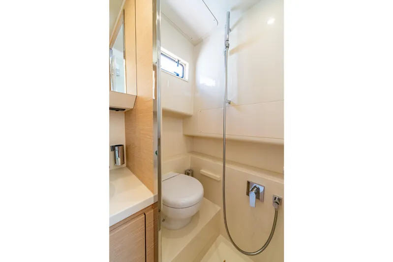  Yacht Photos Pics Modern bathroom in 2027 Solaris Power 40 Open yacht, featuring sleek design and compact amenities.