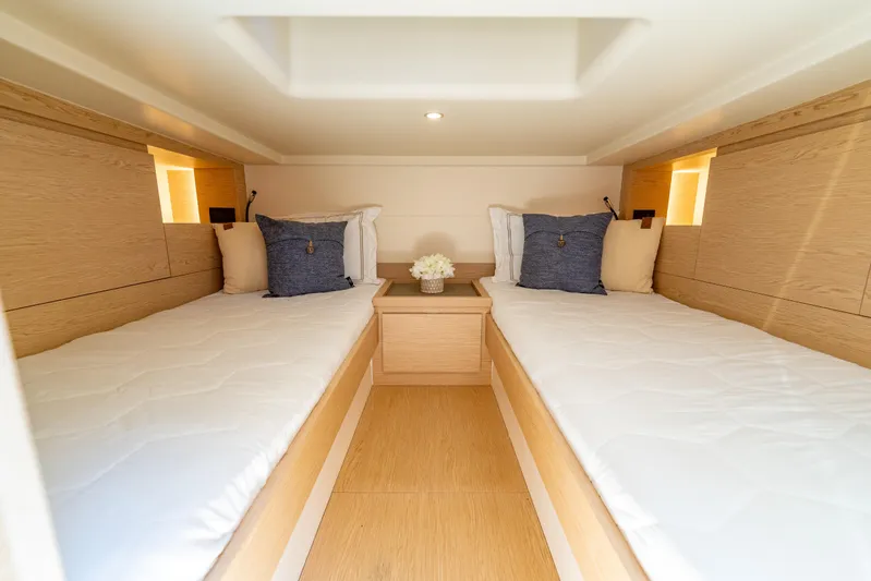  Yacht Photos Pics Luxurious cabin interior of 2027 Solaris Power 40 Open yacht with twin beds.