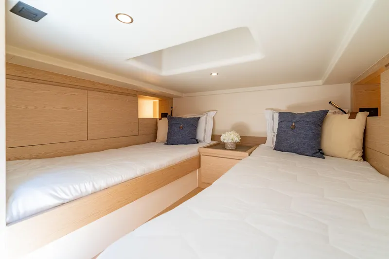  Yacht Photos Pics Luxurious cabin interior of 2027 Solaris Power 40 Open yacht with twin beds.