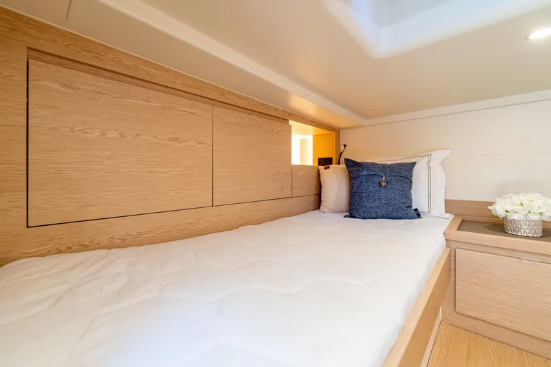  Yacht Photos Pics Cozy cabin interior of 2027 Solaris Power 40 Open yacht with modern wooden design.