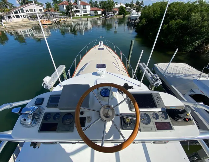 Red Castles Yacht Photos Pics Helm of 2000 Little Harbor 42 Whisper Jet yacht docked in a serene marina.