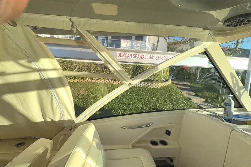 Freedom Yacht Photos Pics Interior view of 2026 Grady-White Freedom 325 boat with seating and window.