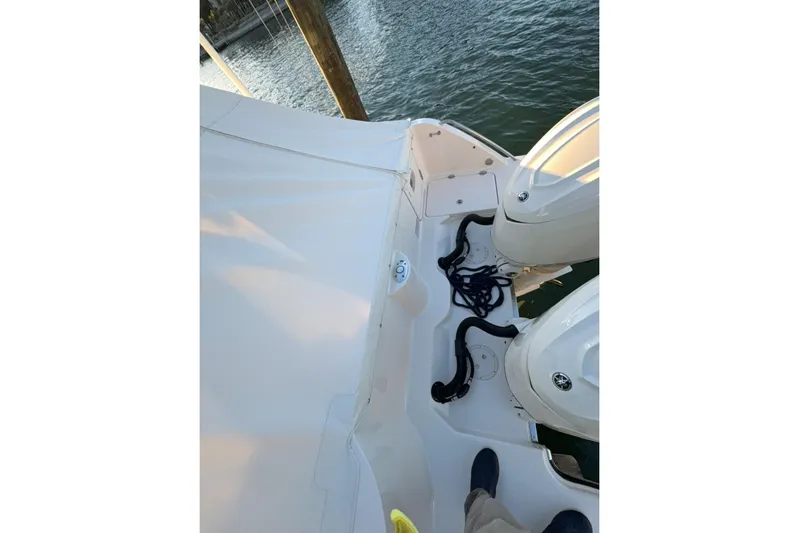 Freedom Yacht Photos Pics 2026 Grady-White Freedom 325 boat deck with twin engines and mooring ropes.