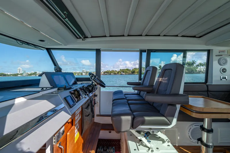  Yacht Photos Pics Interior of 2017 Axopar 37 XC Cross Cabin with modern helm and seating.