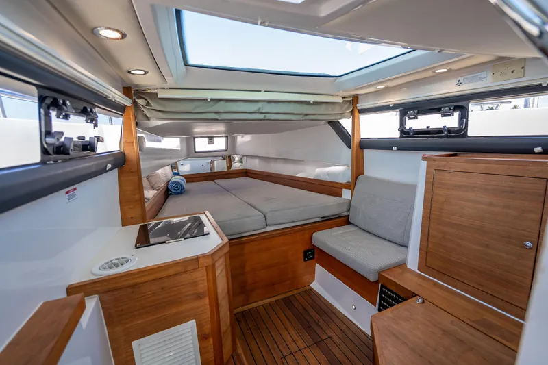  Yacht Photos Pics Interior of 2017 Axopar 37 XC Cross Cabin with wood accents and skylight.