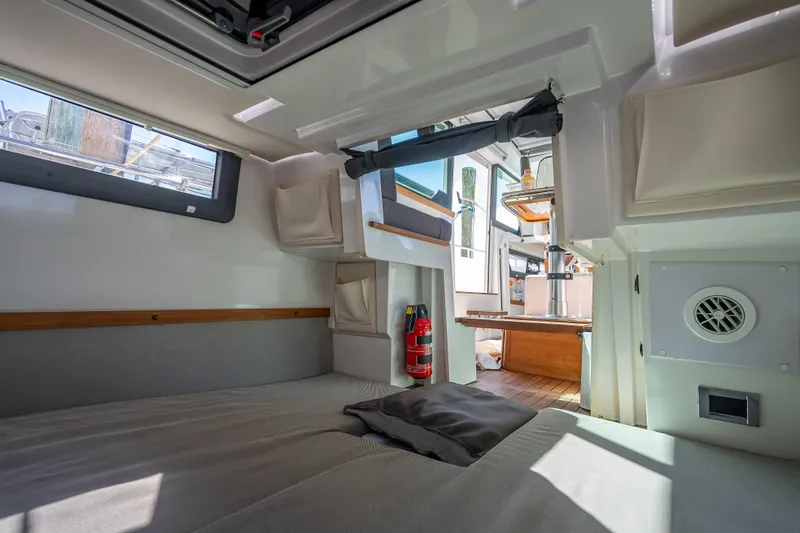  Yacht Photos Pics Interior of 2017 Axopar 37 XC Cross Cabin, featuring cozy sleeping area and modern amenities.