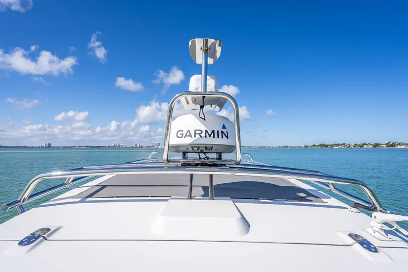  Yacht Photos Pics 2017 Axopar 37 XC Cross Cabin boat with Garmin radar on calm water.
