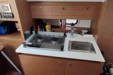  Yacht Photos Pics 2019 Jeanneau Cap Camarat 10.5 WA kitchen with stove and sink.