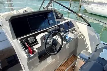  Yacht Photos Pics 2019 Jeanneau Cap Camarat 10.5 WA helm with modern controls and navigation system.