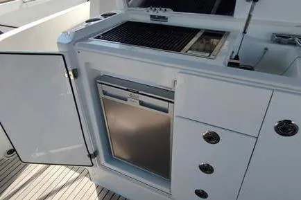  Yacht Photos Pics 2019 Jeanneau Cap Camarat 10.5 WA boat kitchen area with grill and storage.
