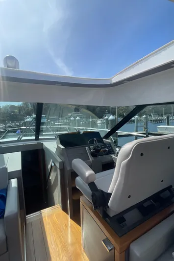  Yacht Photos Pics 2020 Tiara Yachts 53 Coupe interior helm with modern design and panoramic windows.