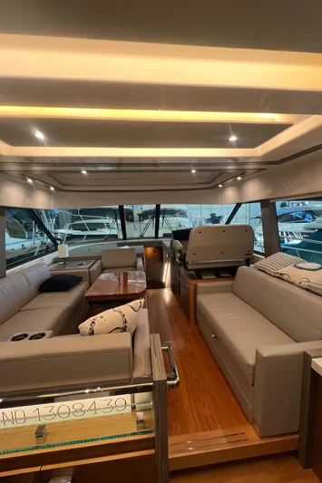  Yacht Photos Pics Luxurious interior of 2020 Tiara Yachts C53 Coupe with elegant seating and modern design.