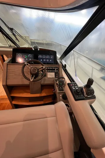  Yacht Photos Pics 2020 Tiara Yachts C53 Coupe helm with modern controls and navigation displays.