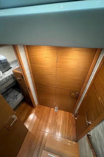  Yacht Photos Pics 2020 Tiara Yachts C53 Coupe interior with wooden flooring and cabinetry.