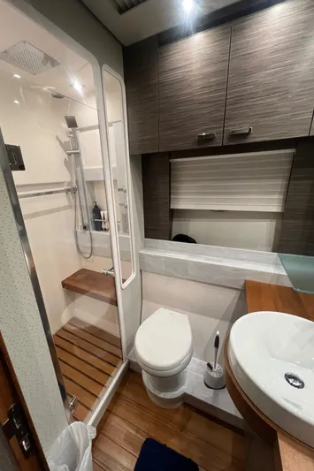  Yacht Photos Pics Modern bathroom in 2020 Tiara Yachts C53 Coupe with shower, toilet, and sink.