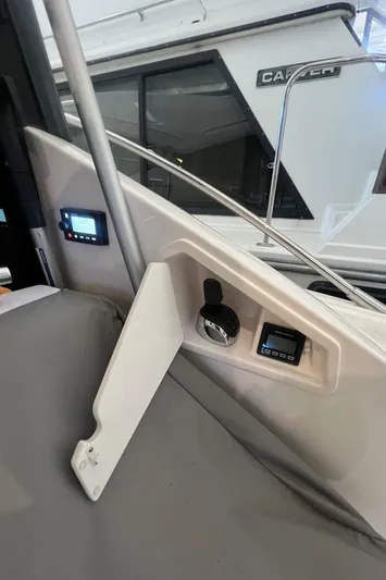  Yacht Photos Pics 2020 Tiara Yachts C53 Coupe interior dashboard with control panels and instruments.