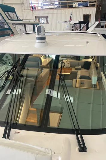  Yacht Photos Pics 2020 Tiara Yachts C53 Coupe interior view through windshield in a showroom setting.
