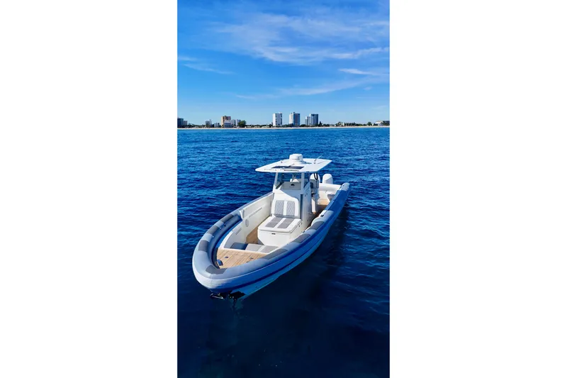  Yacht Photos Pics Ocean 1 370 boat on blue water, 2022 model, with city skyline in background.