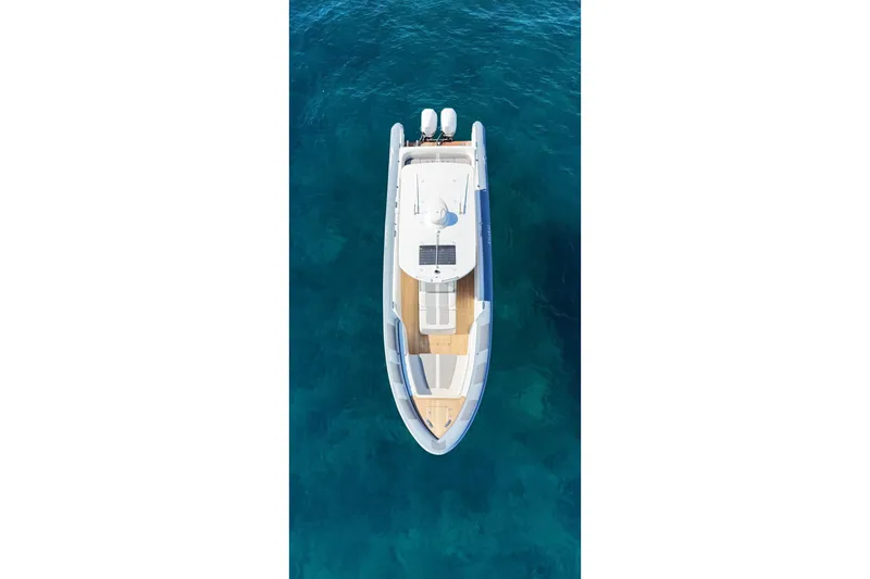  Yacht Photos Pics Aerial view of 2022 Ocean 1 model 370 boat on clear blue water.