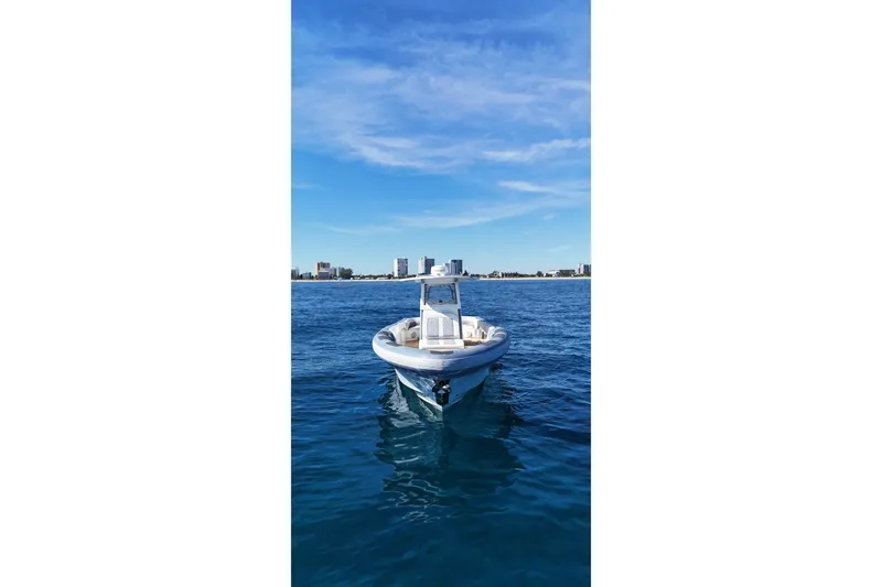 Yacht Photos Pics Ocean 1 370 boat on calm blue water, city skyline in background, 2022 model.