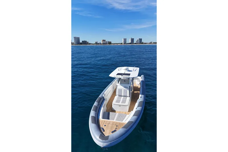  Yacht Photos Pics Modern Ocean 1 370 boat on blue water, city skyline in background, 2022 model.