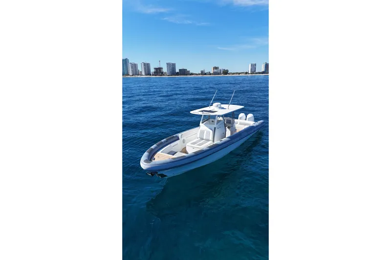  Yacht Photos Pics Ocean 1 370 boat on blue water with city skyline in background, 2022 model.