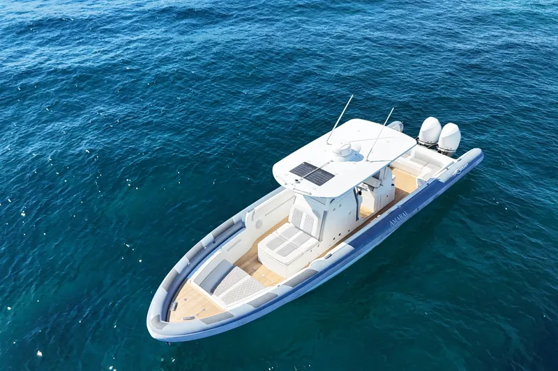  Yacht Photos Pics Aerial view of 2022 Ocean 1 model 370 boat on clear blue water.