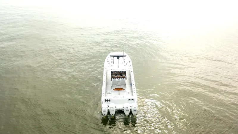  Yacht Photos Pics Aerial view of 2023 Freeman 42 LR boat on calm water.