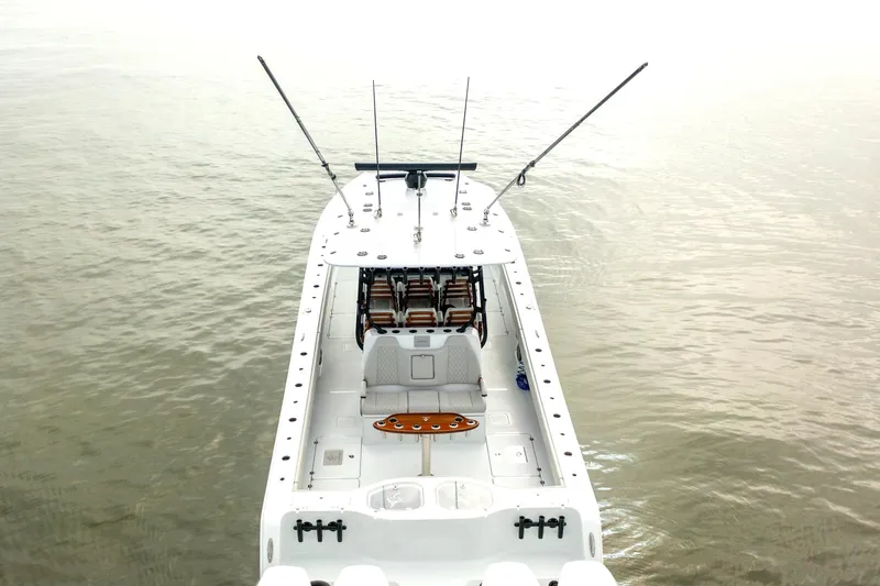  Yacht Photos Pics Freeman 42 LR 2023 boat on calm water, aerial view, fishing rods visible.