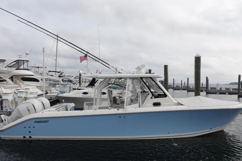 Yacht Photos Pics 2024 Pursuit S 328 Sport boat docked at marina, side view.