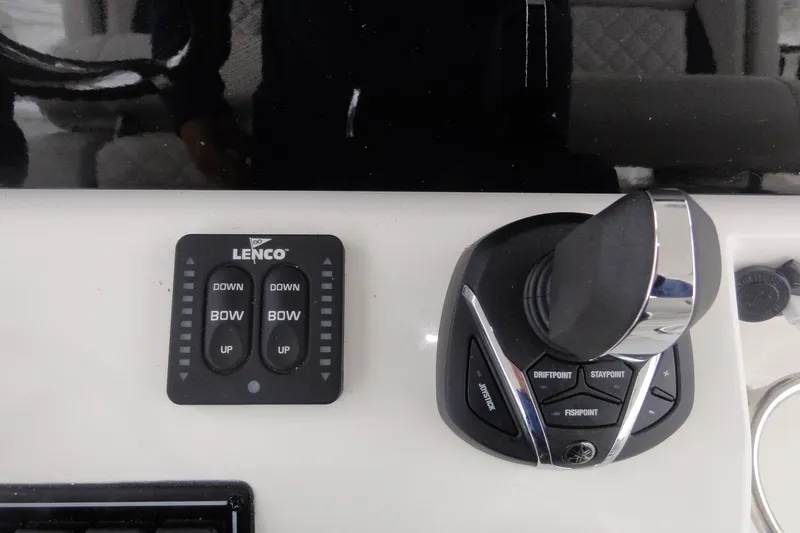  Yacht Photos Pics Control panel of 2024 Pursuit S 328 Sport boat with joystick and Lenco trim tab.