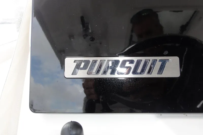  Yacht Photos Pics 2024 Pursuit S 328 Sport logo on a glossy black surface.
