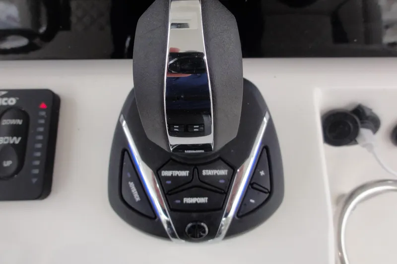  Yacht Photos Pics 2024 Pursuit S 328 Sport boat control panel with joystick and function buttons.