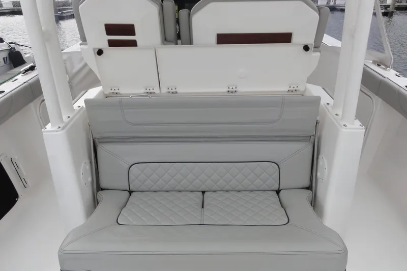  Yacht Photos Pics 2024 Pursuit S 328 Sport boat with luxurious gray seating and quilted design.
