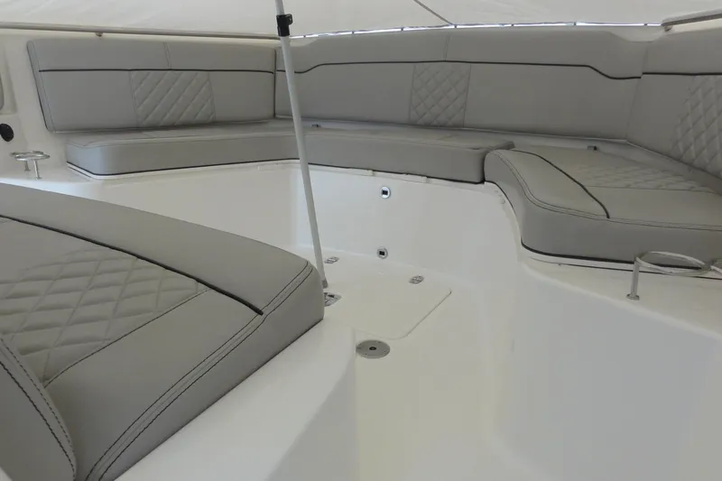  Yacht Photos Pics 2024 Pursuit S 328 Sport boat interior with gray cushioned seating.