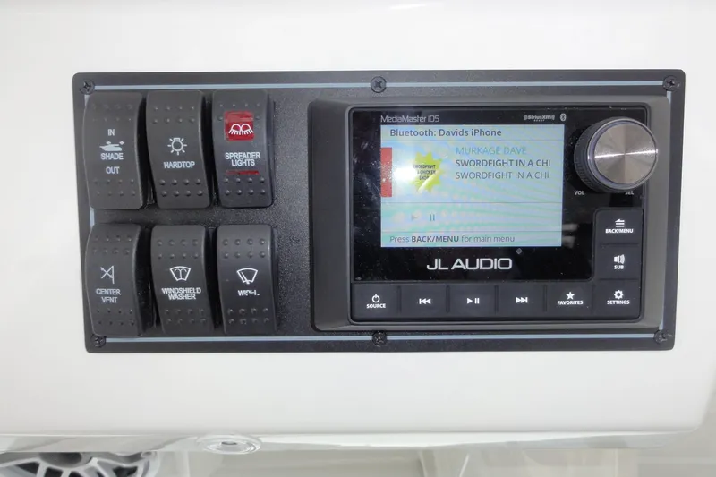  Yacht Photos Pics Control panel of 2024 Pursuit S 328 Sport with JL Audio system and various switches.