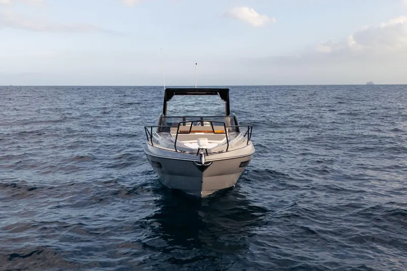  Yacht Photos Pics 2026 Hanover 305 boat on open sea, front view, under clear sky.