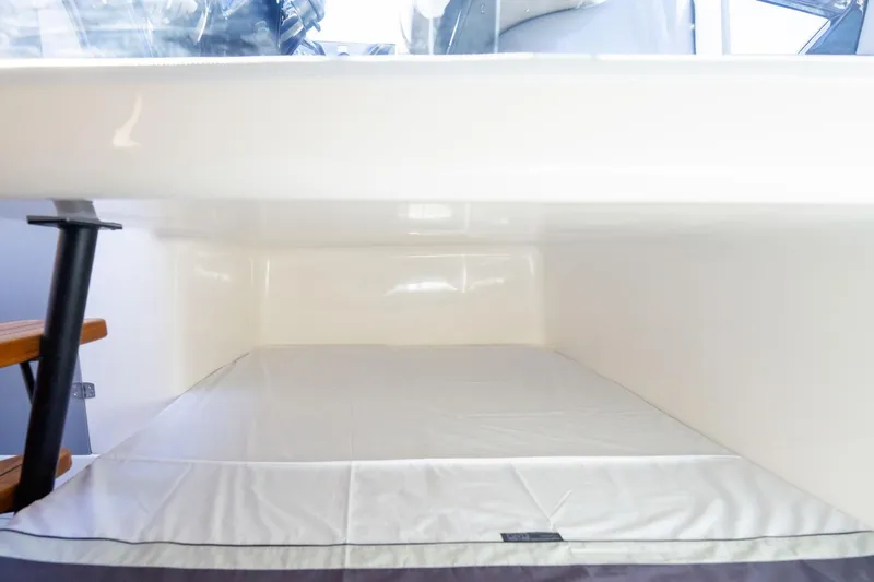  Yacht Photos Pics Interior cabin of 2026 Hanover 305 boat with white bedding.