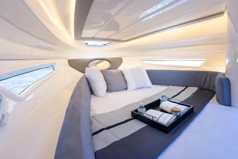  Yacht Photos Pics Luxurious interior of 2026 Hanover 305 yacht with cozy bed and elegant decor.