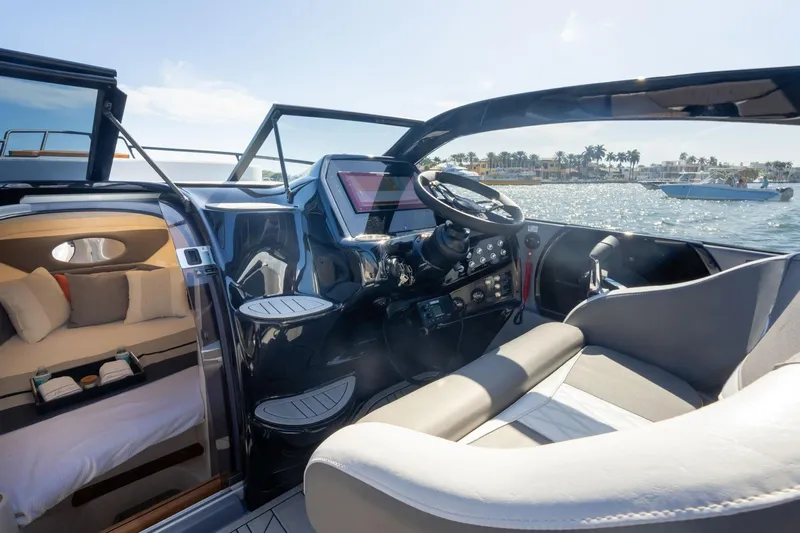  Yacht Photos Pics Interior view of 2026 Hanover 305 boat, featuring modern cockpit and cozy cabin.
