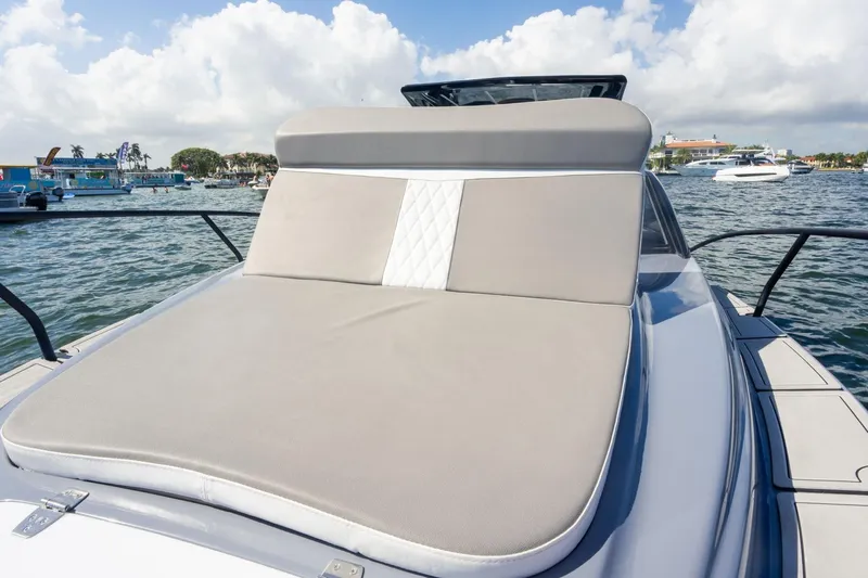  Yacht Photos Pics Luxurious 2026 Hanover 305 yacht with spacious sunbathing deck on a sunny day.