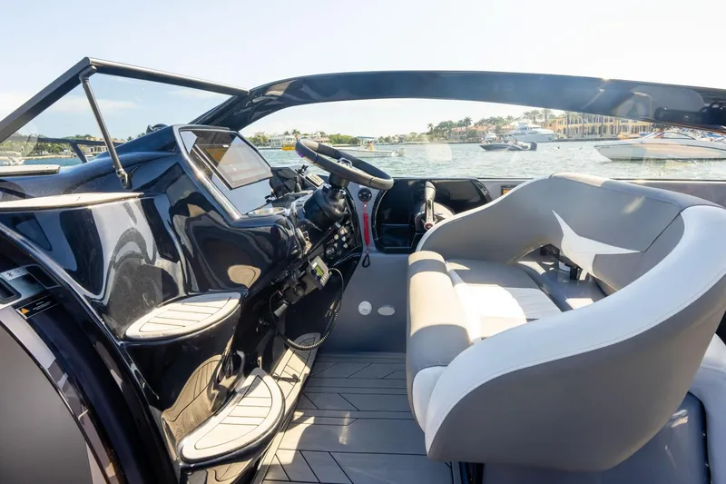  Yacht Photos Pics Luxurious 2026 Hanover 305 boat interior with sleek design and waterfront view.