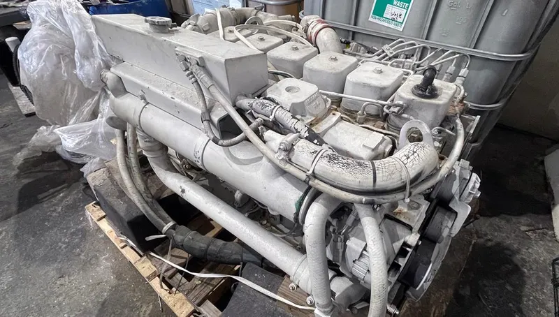  Yacht Photos Pics 2002 Fountain 38 Express Cruiser engine on a wooden pallet in a workshop.