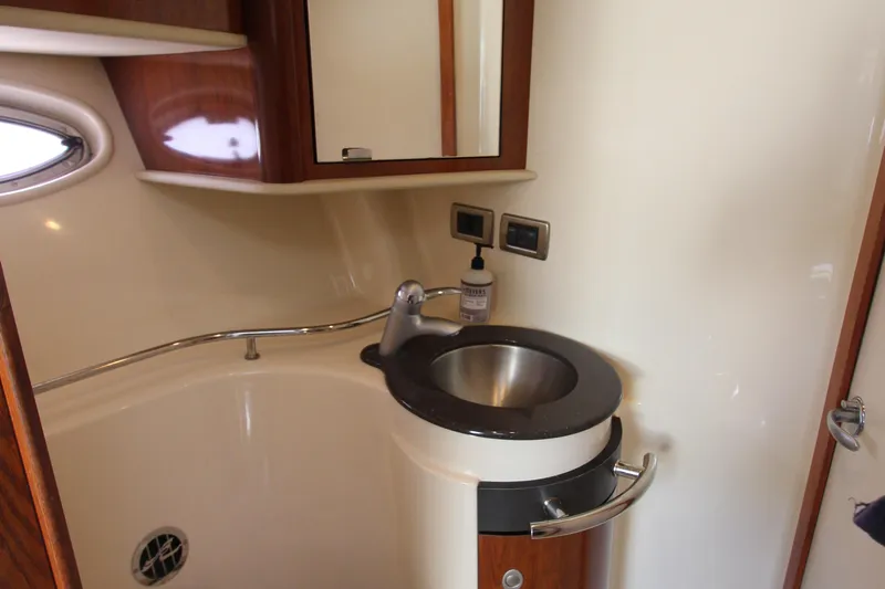 Yacht Photos Pics 2004 Sea Ray 40 Sundancer bathroom with modern sink and wooden cabinetry.